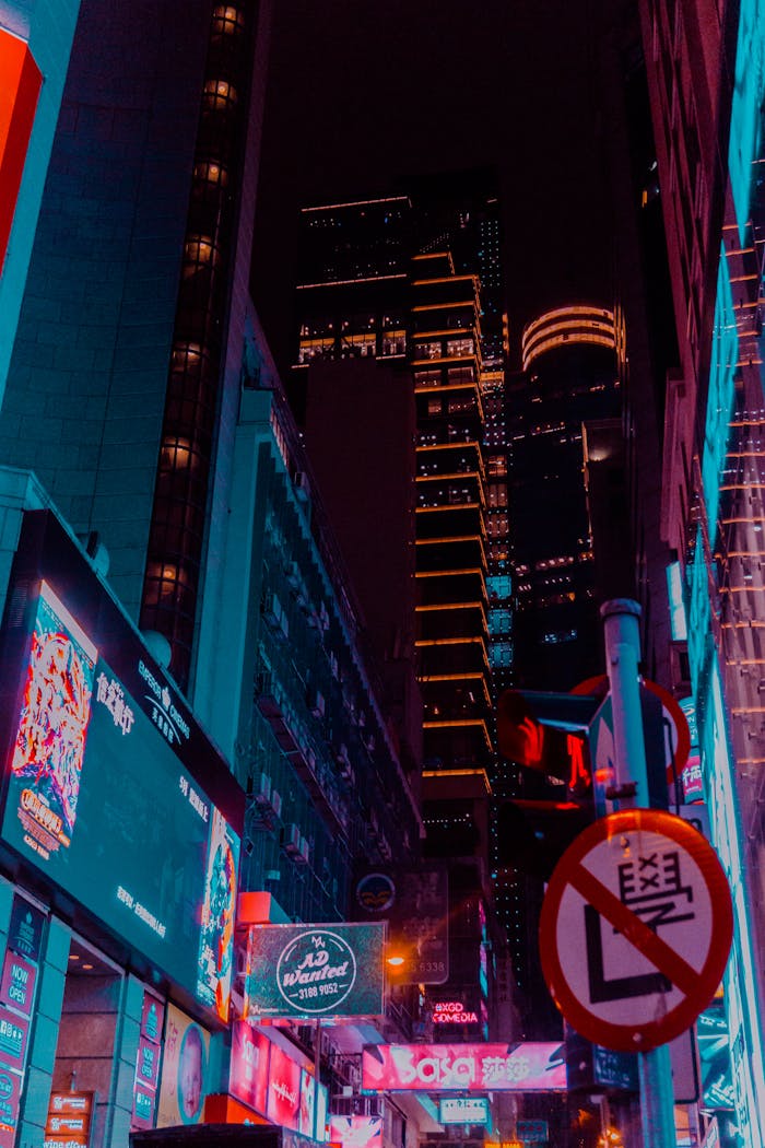 Explore the vibrant neon-lit streets of Kowloon, Hong Kong, capturing the bustling nightlife and urban allure.